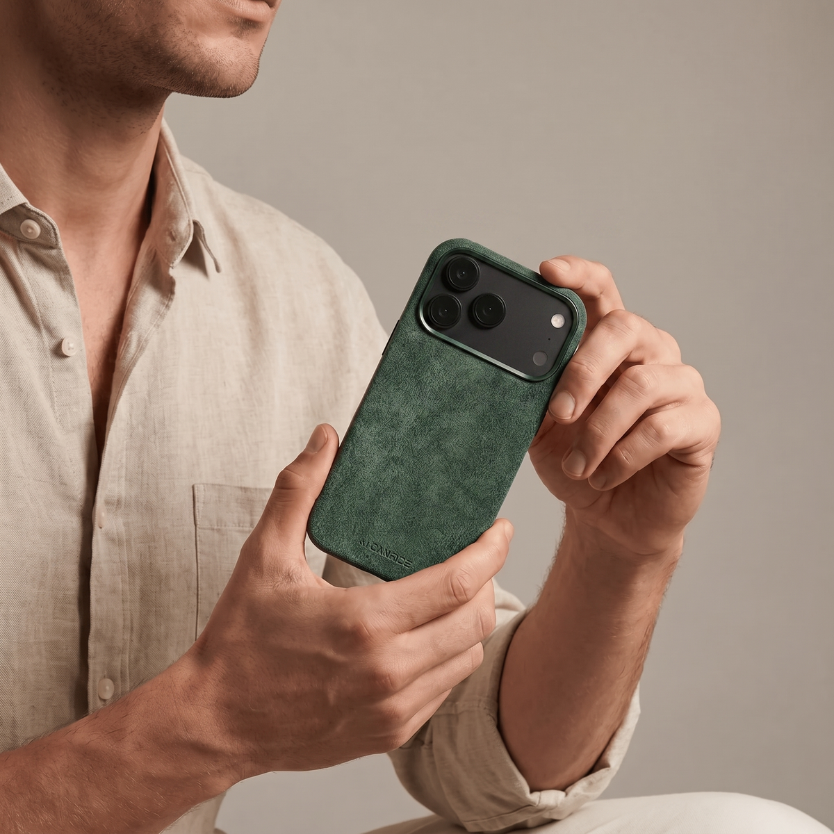 Midnight Green Alcantara case for iPhone 18 Pro held in hands #iPhone model:_iPhone 18 Pro|iPhone 18 Pro Max
