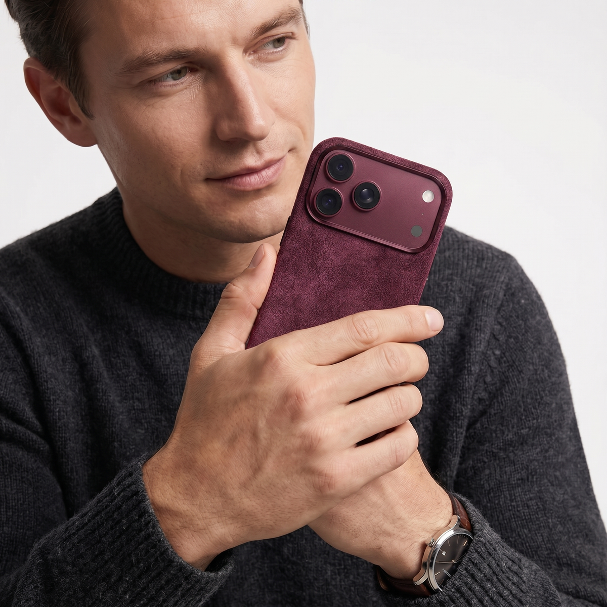 Wine Red Alcantara case for iPhone 18 Pro held in hands #iPhone model:_iPhone 18 Pro|iPhone 18 Pro Max